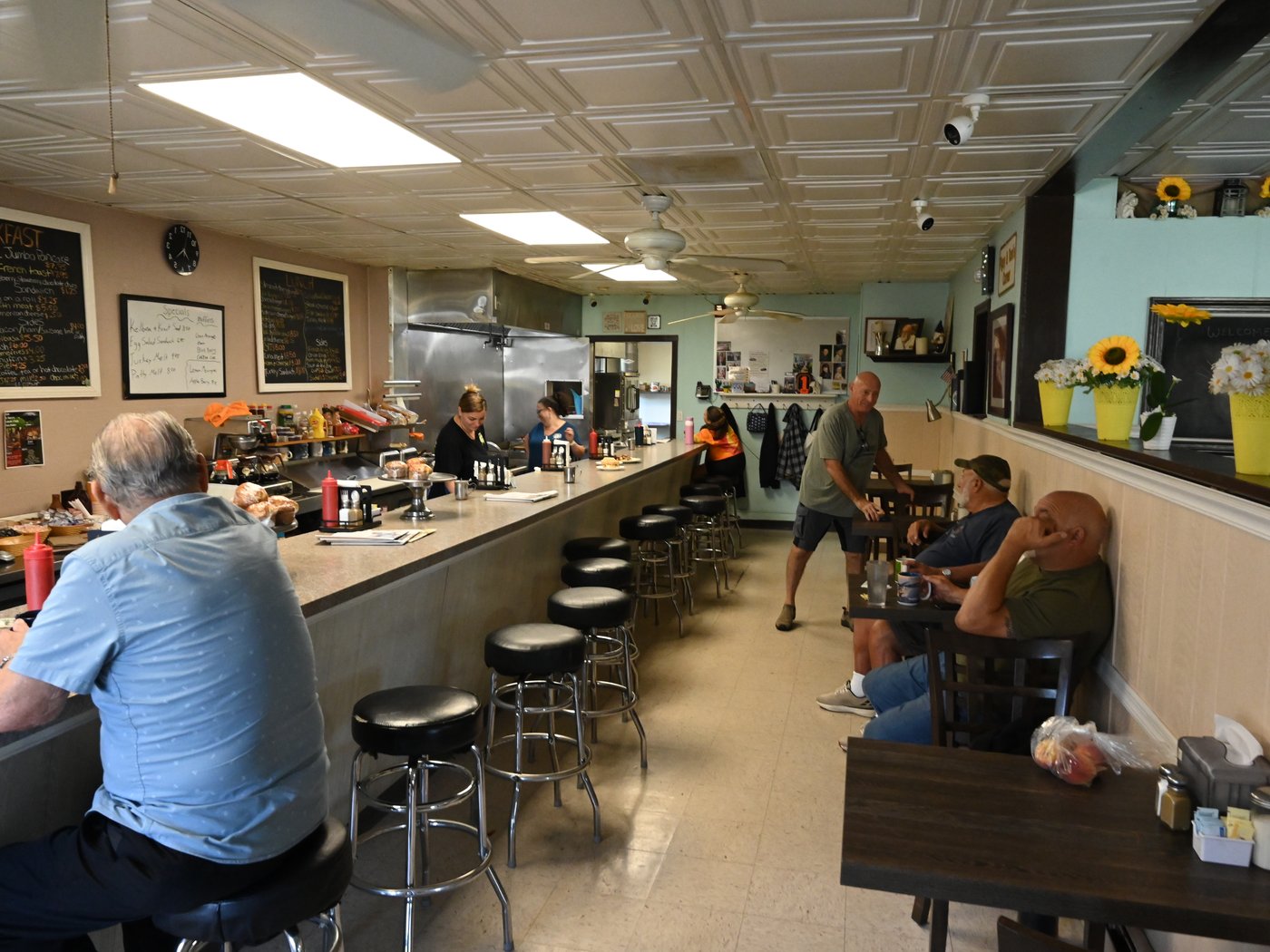 The counter and stools at Tom's Place on a weekday morning
